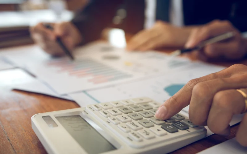 man using calculator to safe the cost of cleaning