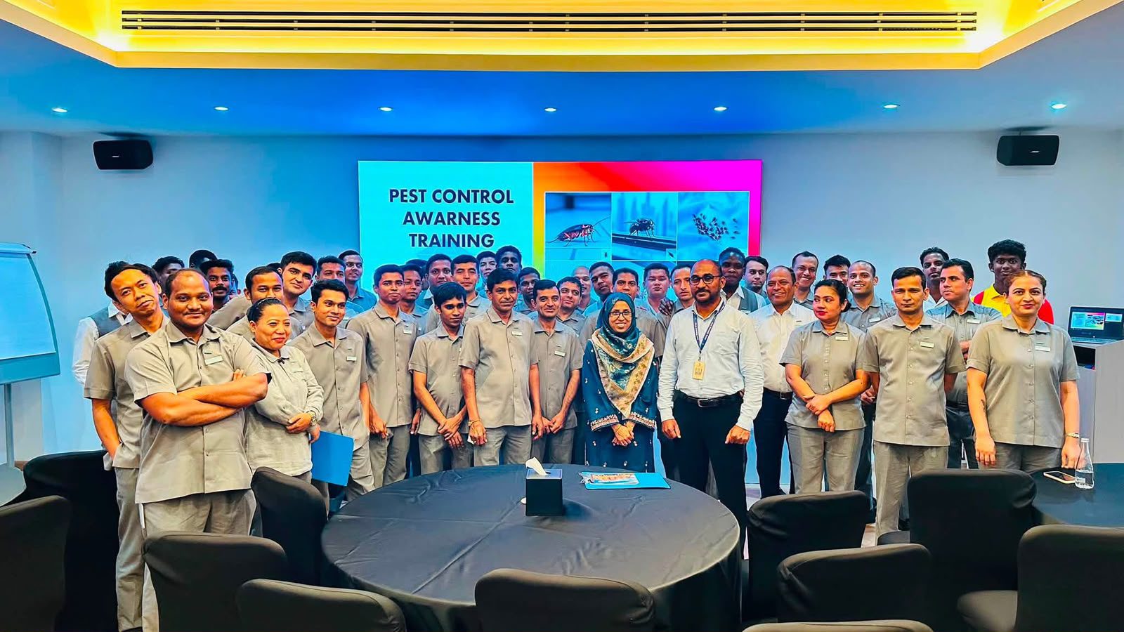 Blue Diamond employees attending a Pest Control Awareness Training session in a conference room to improve pest management knowledge and workplace safety.