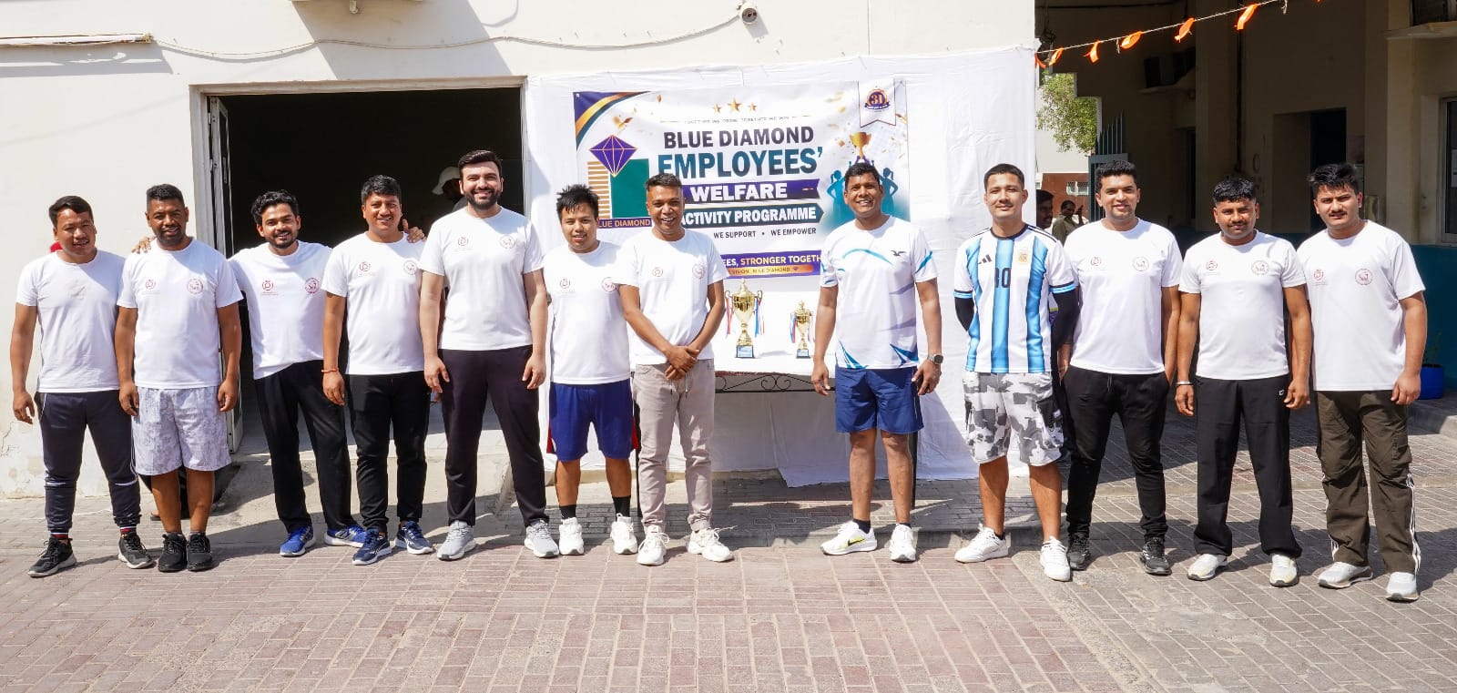 Employees participating in the Blue Diamond Group Tug of War Competition at Sonapur Camp in Dubai.