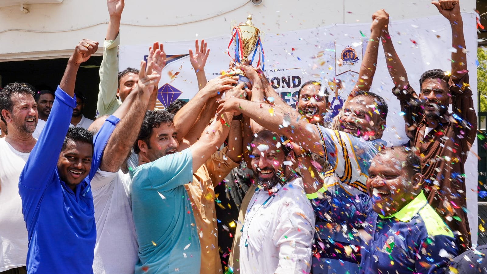 Winning team celebrating victory during the Blue Diamond Group Tug of War Competition.